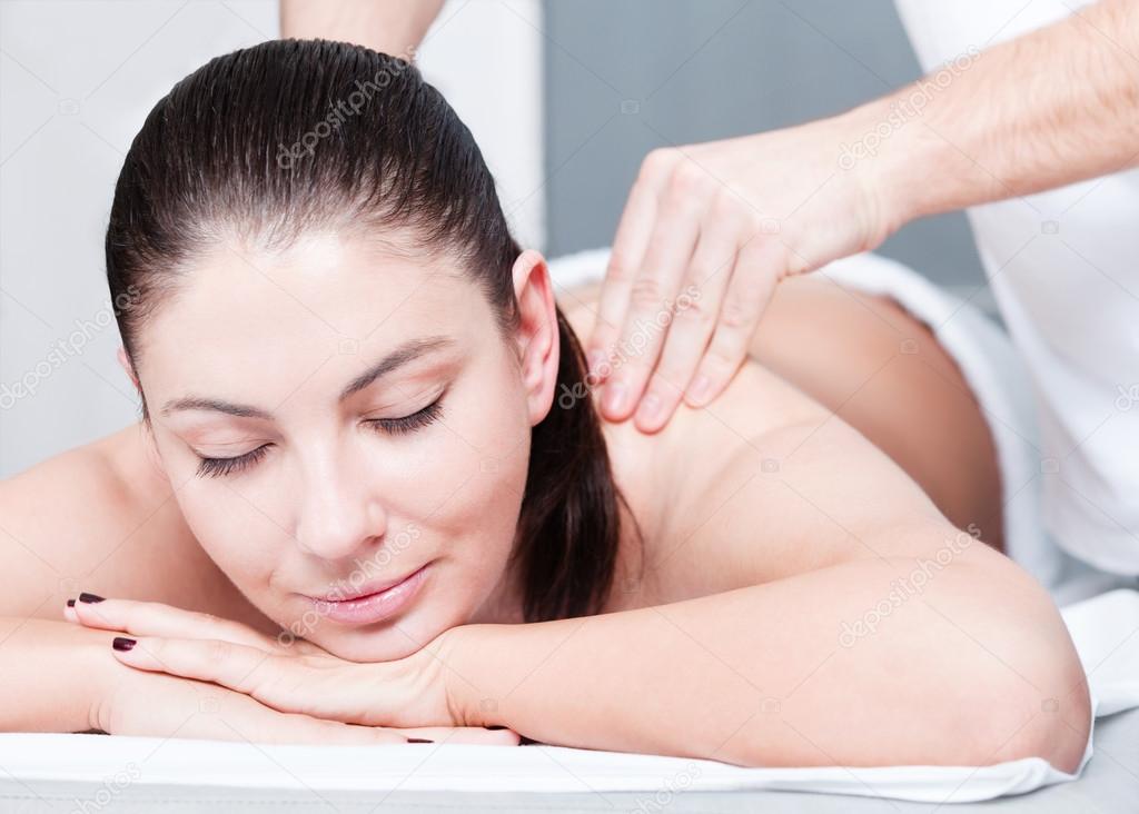 Woman receives massage therapy