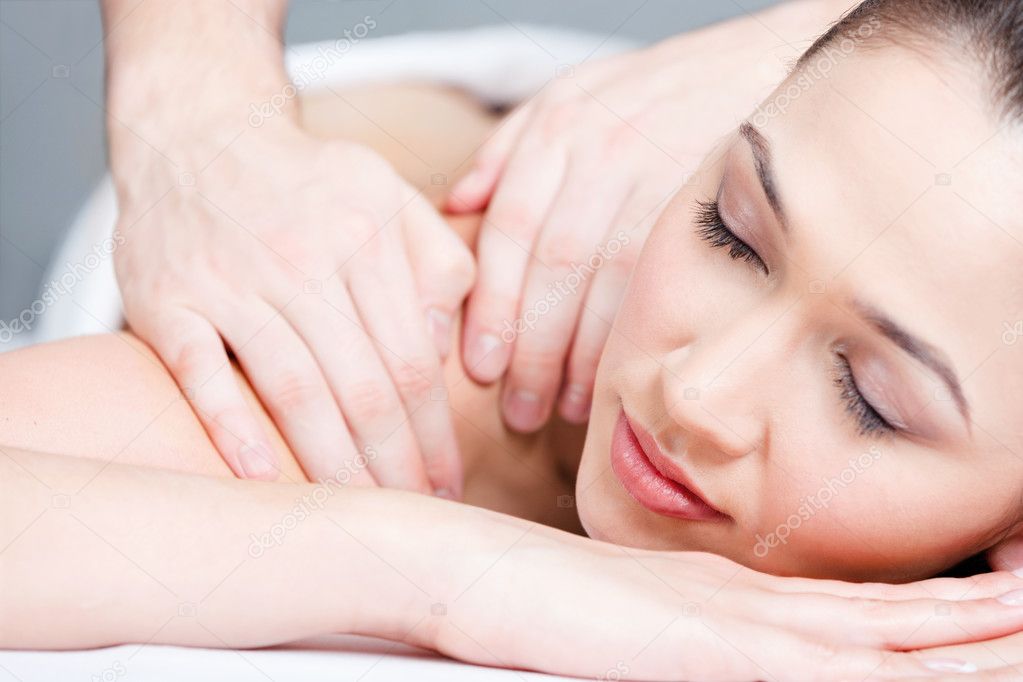 Woman receives body massage