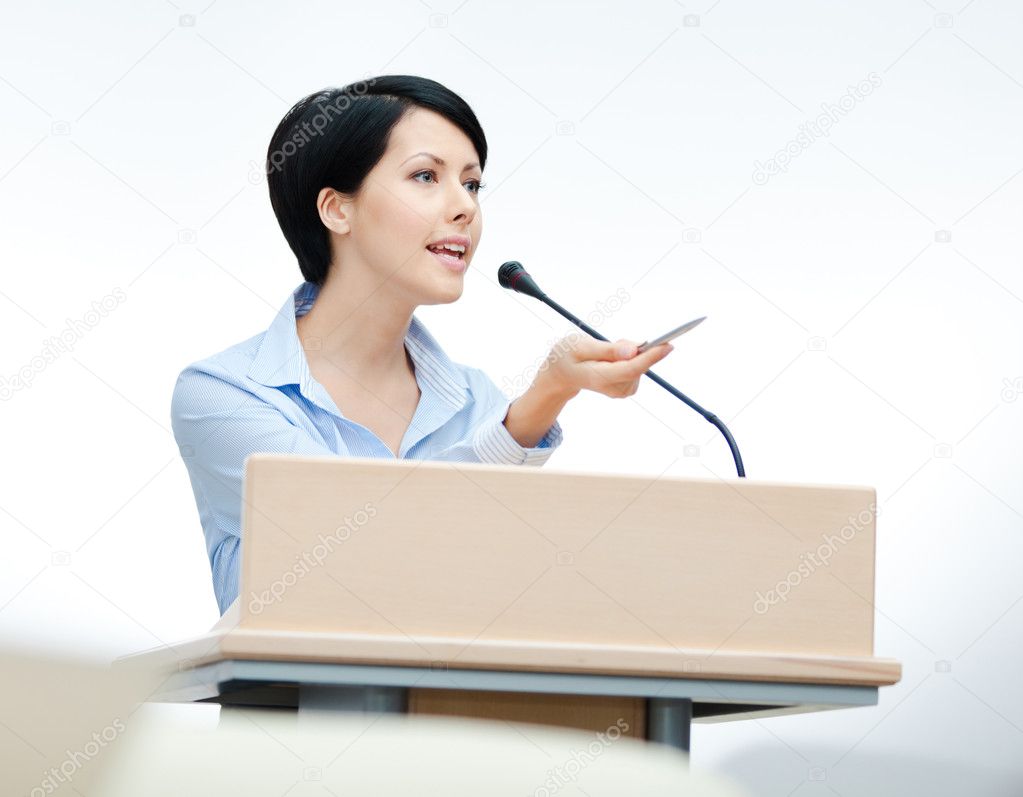 Pretty woman speaker at the podium