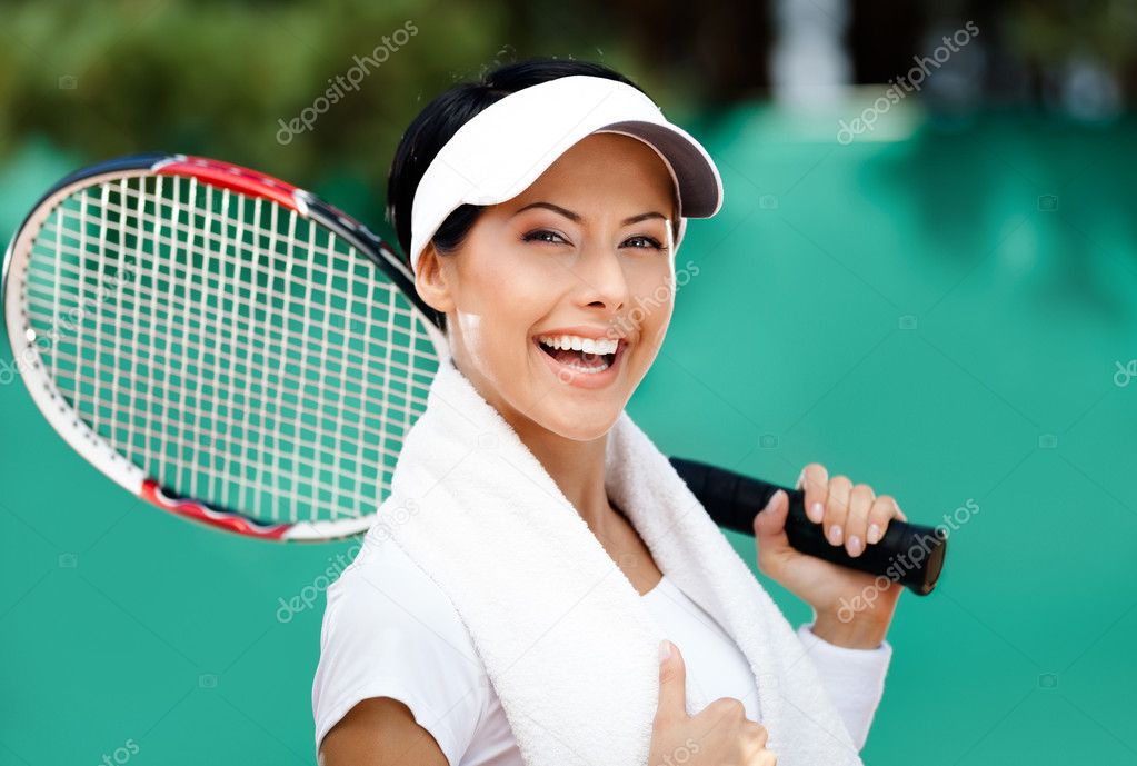 Female tennis player with towel on her shoulders