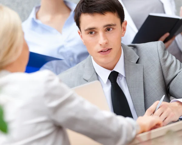 Young businessman with colleagues — Stock Photo, Image