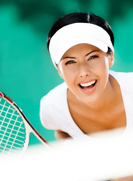 Kvinna i sportkläder spela tennis — Stockfoto