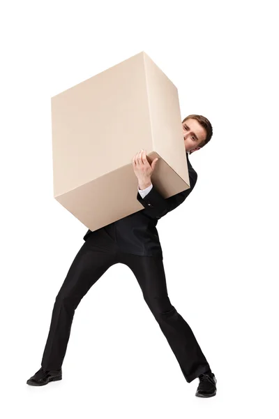 Gerente carrega uma caixa enorme — Fotografia de Stock