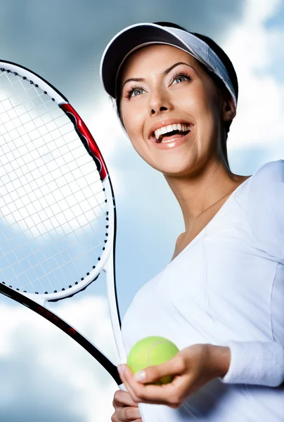 Female tennis player against the sky Stock Picture