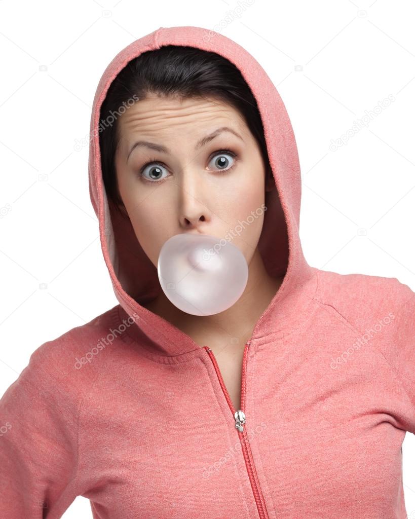 Female blows out pink bubble gum