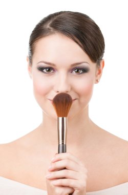 Woman with cosmetic brush