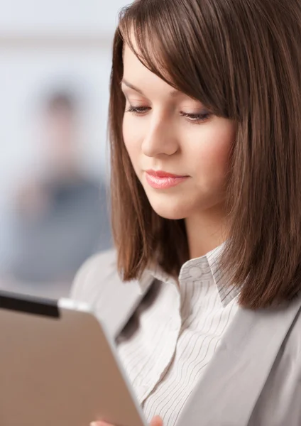 Female manager with pad at the office — Stock Photo, Image