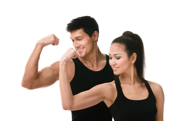 Dos deportivos en negro mostrando bíceps — Foto de Stock