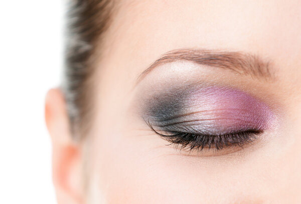 Close up of woman's closed eye with makeup