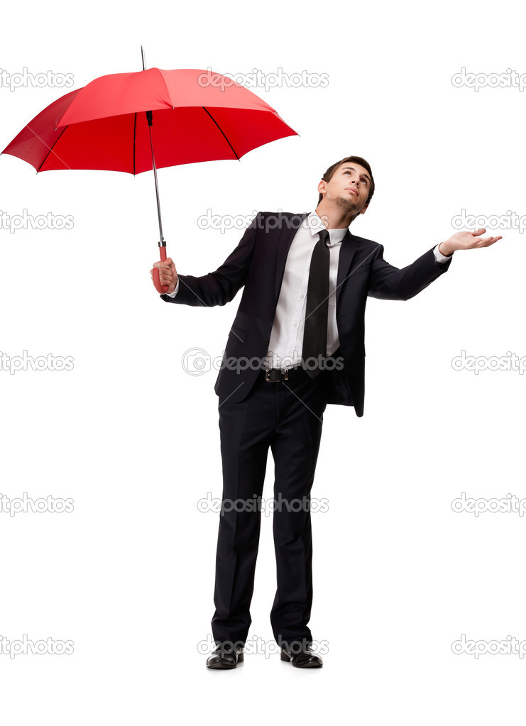 Palming up business man with umbrella checks the rain