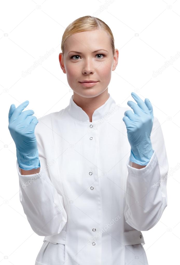 Medic puts on blue rubber gloves