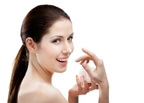 Woman putting on cream on her nose — Stock Photo, Image
