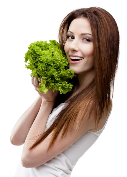 Frau reicht frische Salatblätter — Stockfoto