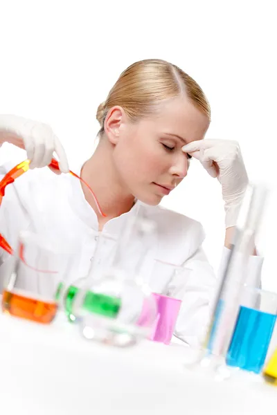 Tired female doctor puts the glasses off — Stock Photo, Image