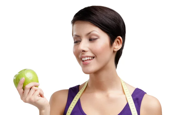 Dame met flexibele liniaal en groene appel — Stockfoto