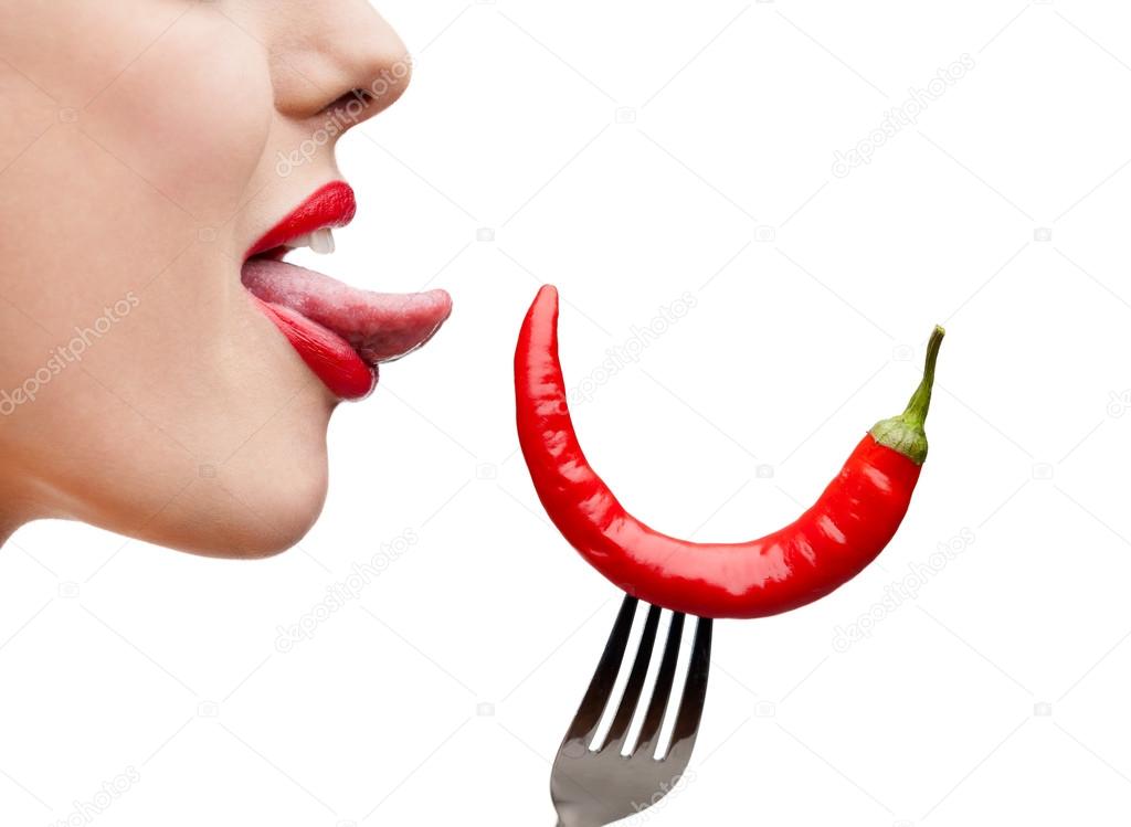 Close up of woman's tongue and capsicum
