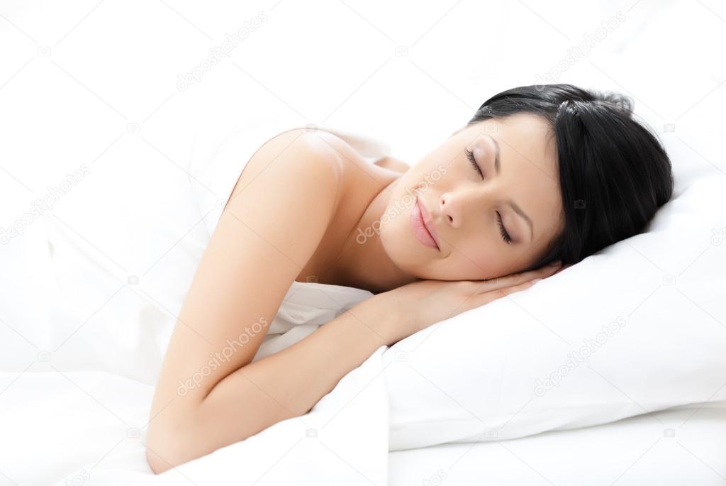 Woman sleeps in bed
