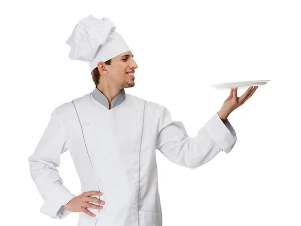 Chief cook handing a white plate — Stock Photo, Image