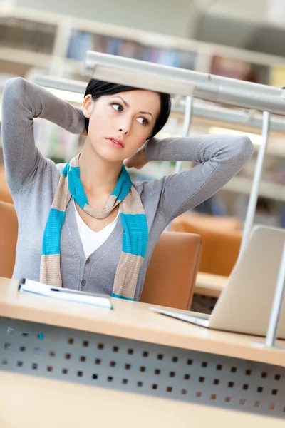 Stretching woman working on the pc — Stock Photo, Image