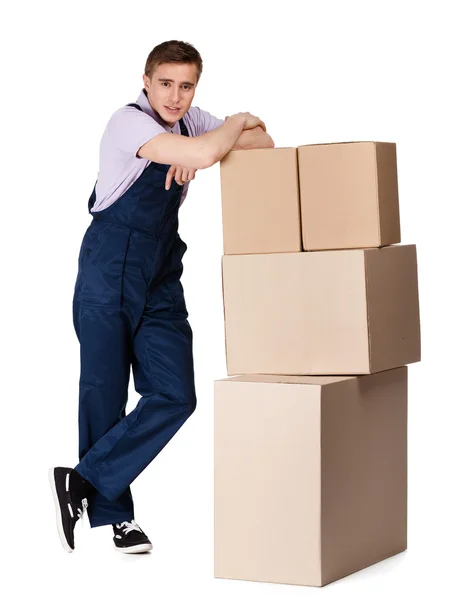 Young delivery man in overalls with containers — Stock Photo, Image