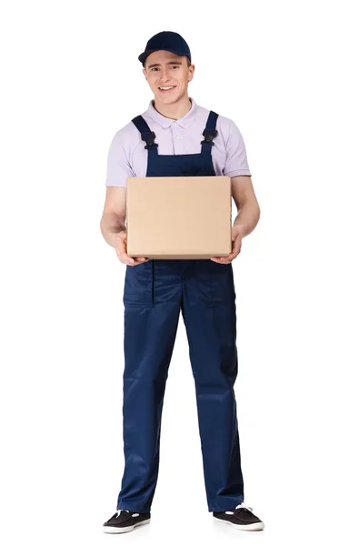 Workman in overalls keeps a box — Stock Photo, Image