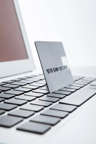 Close up shot of credit card on a laptop keyboard — Stock Photo, Image