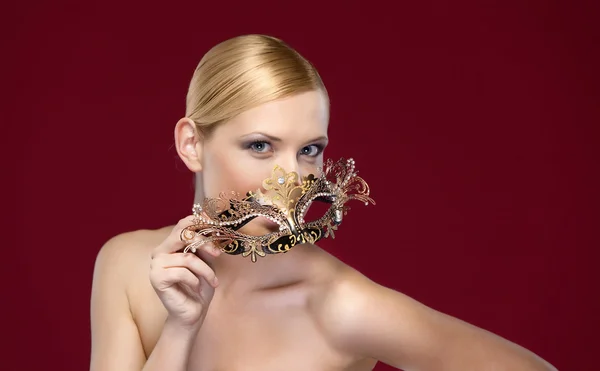 Woman with patterned masquerade mask — Stock Photo, Image