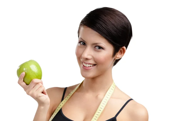 Mujer con regla flexible y manzana verde saludable —  Fotos de Stock