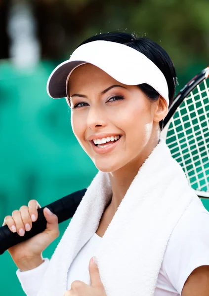 Professional female tennis player with towel on her shoulders — Stock Photo, Image