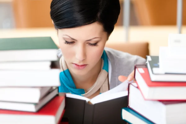 Reading book student sitting at the desk — Stock Photo, Image