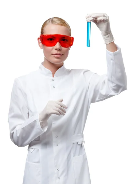 Woman doctor in spectacles holds a vial — Stock Photo, Image