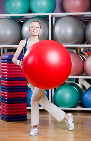 Woman exercises with gym ball — Stock Photo, Image