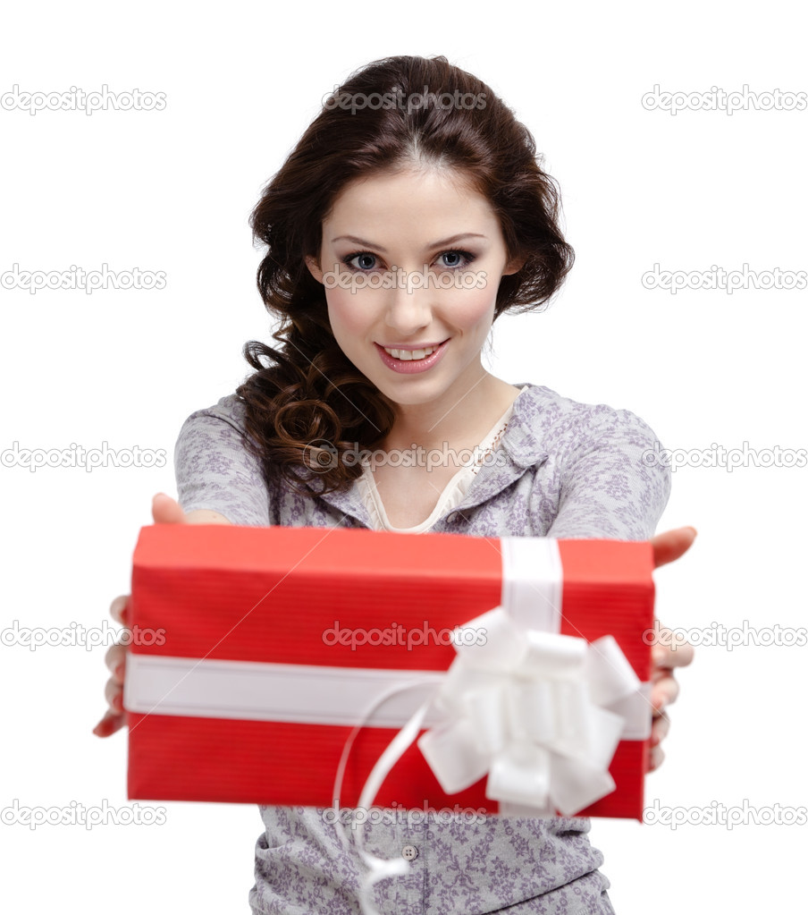 Young woman reaches out a gift