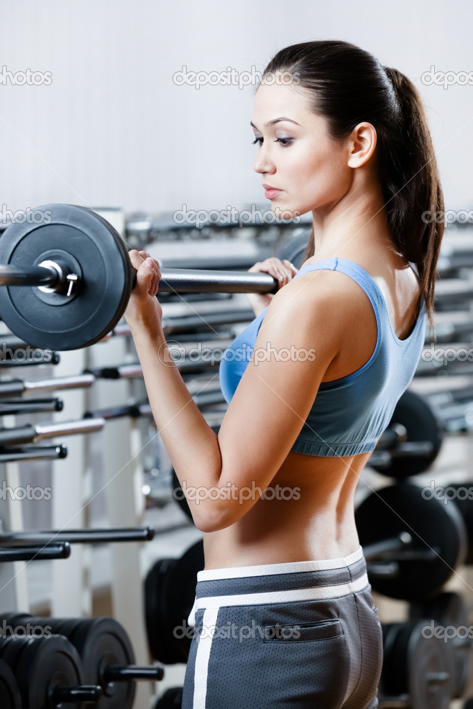 Athlete woman with dumbbells
