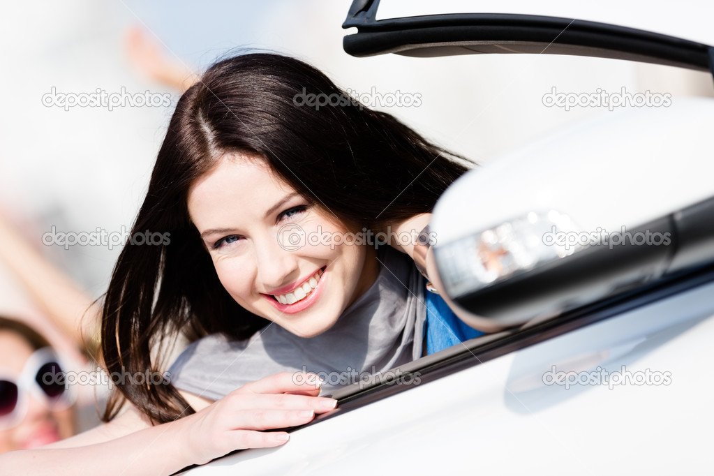 Close up view of woman in the white car