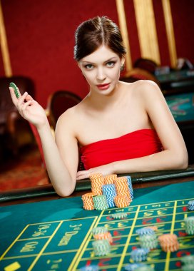 Girl plays at the casino club clipart