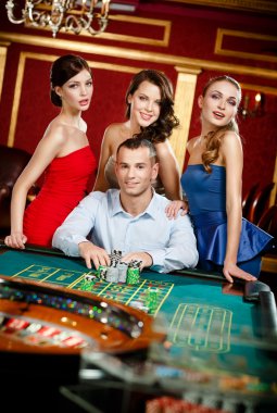 Man surrounded by young girls gambles roulette clipart