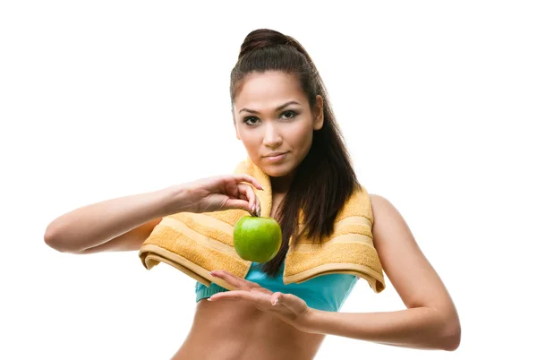 Donna sportiva mani mela verde — Foto Stock