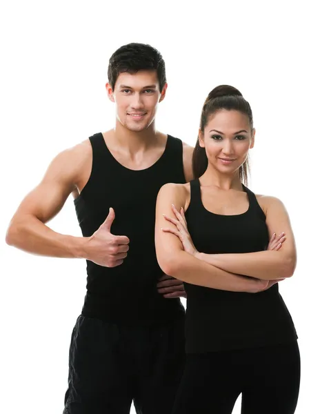Two sportive in black sports wear Royalty Free Stock Photos