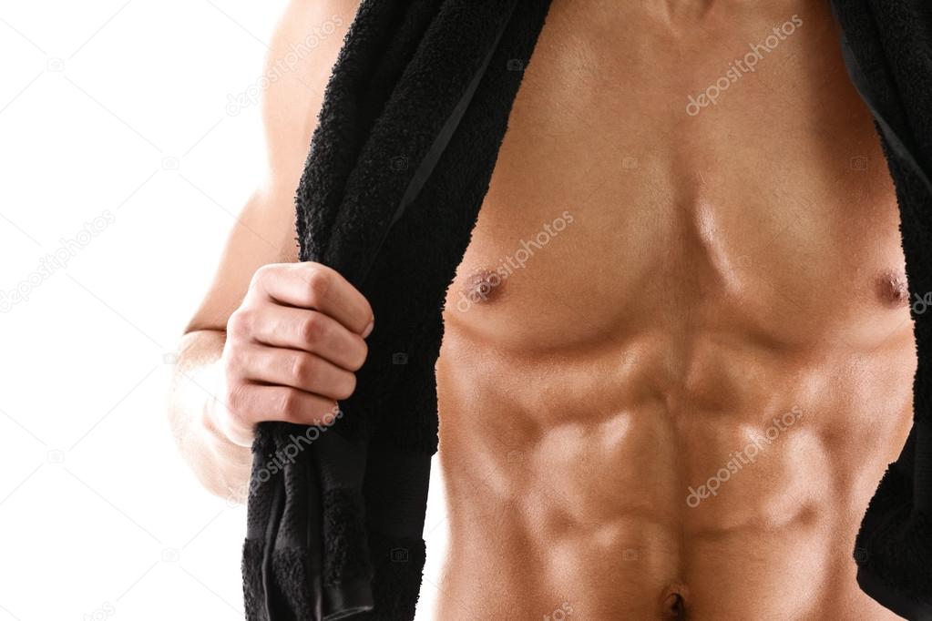 Sexy body of muscular man with black towel
