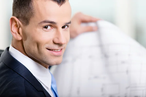 Close up of business man with layout — Stock Photo, Image