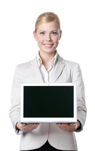 Smiling businesswoman offers computer product — Stock Photo, Image