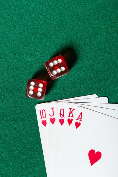 Royal Flush poker card sequence near dices — Stock Photo, Image