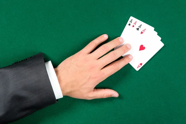 Top view of hand with aces on the table — Stock Photo, Image