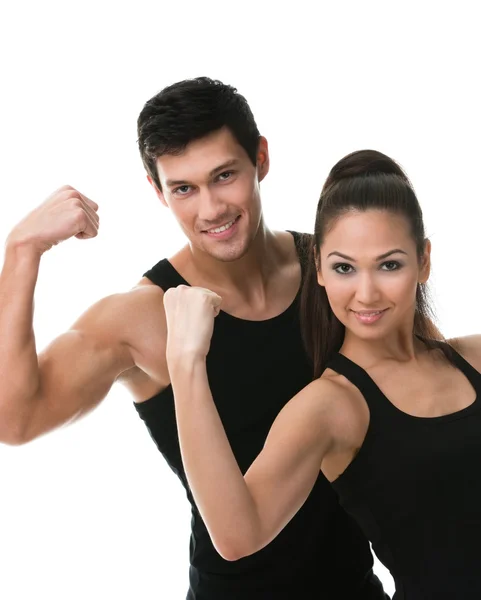 Two sportive showing their biceps Stock Image