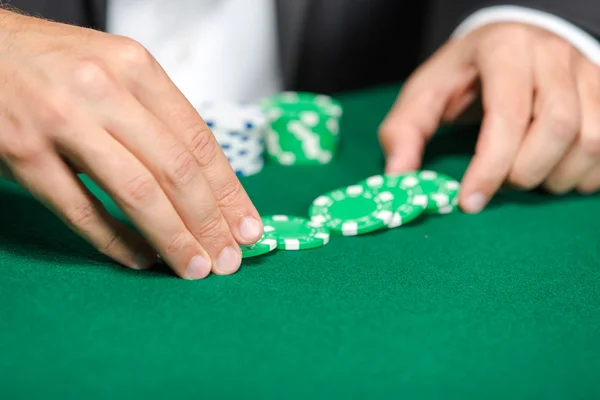 Gambler puts the chips on the table — Stock Photo, Image