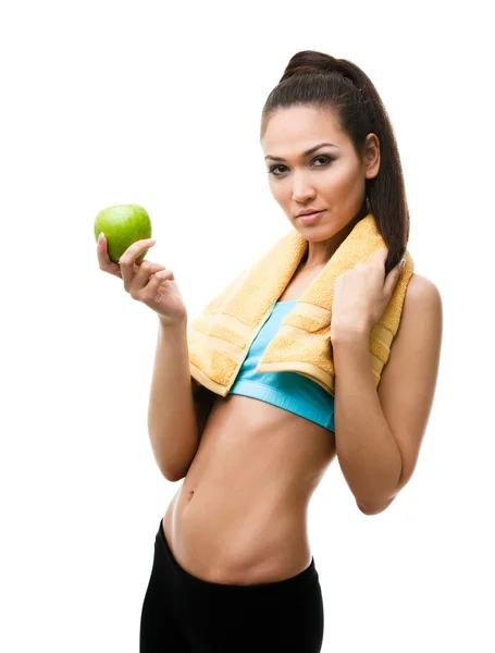 Sportovní žena ruce zelené jablko — Stock fotografie