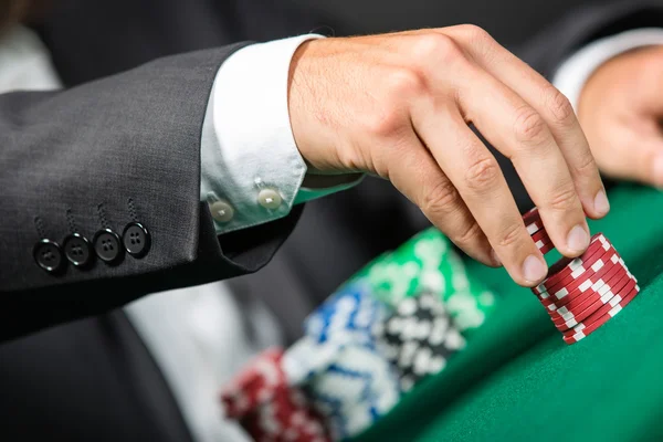 Gambler stakes the pile of chips — Stock Photo, Image