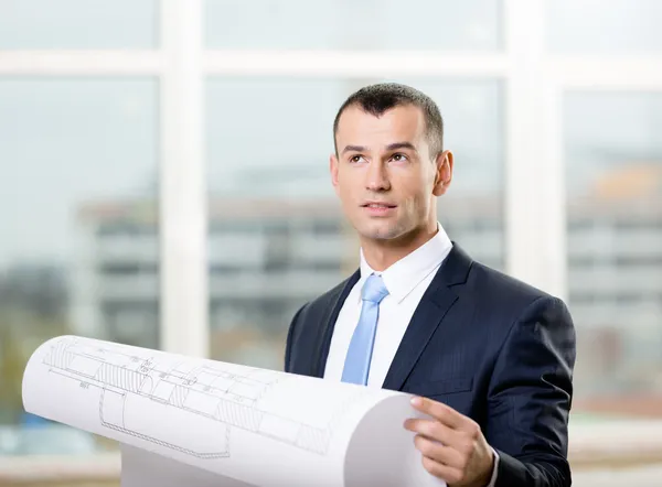 Pensive engineer hands blueprint — Stock Photo, Image