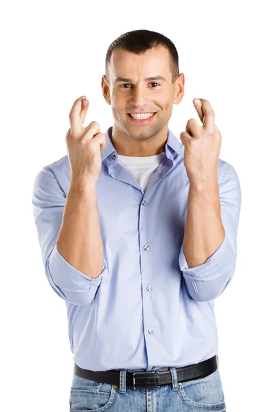 Человек со скрещенными пальцами — стоковое фото